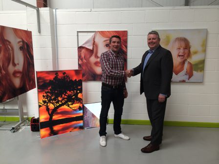 DPI's Stewart Bell (right) welcomes new director Simeon Wicks, with Primex frames on show in the background